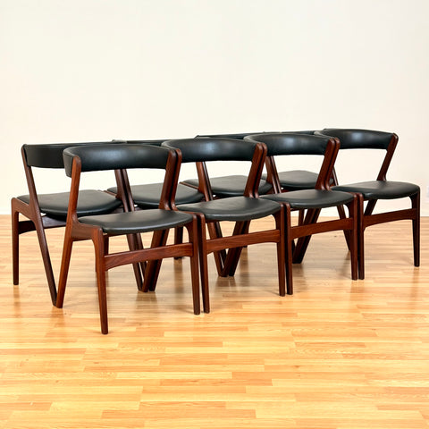 Danish dining chairs in walnut by Kai Kristiansen