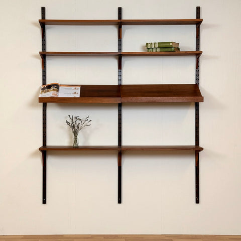 Danish wall unit / shelving system in walnut by Poul Cadovius
