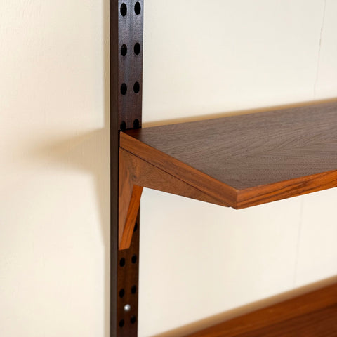 Danish wall unit / shelving system in walnut by Poul Cadovius