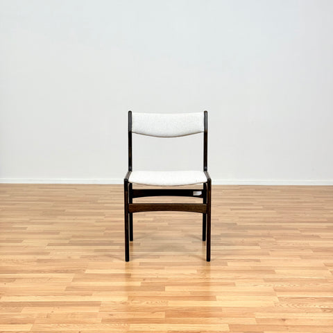 Danish dining chairs in solid stained oak by Erik Buch
