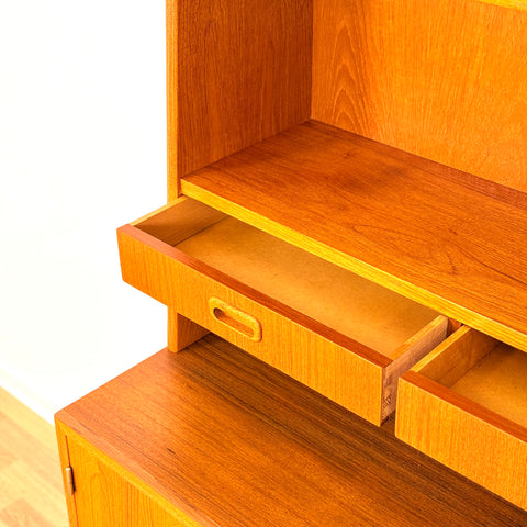 Reserved Swedish bookshelf with writing desk in teak