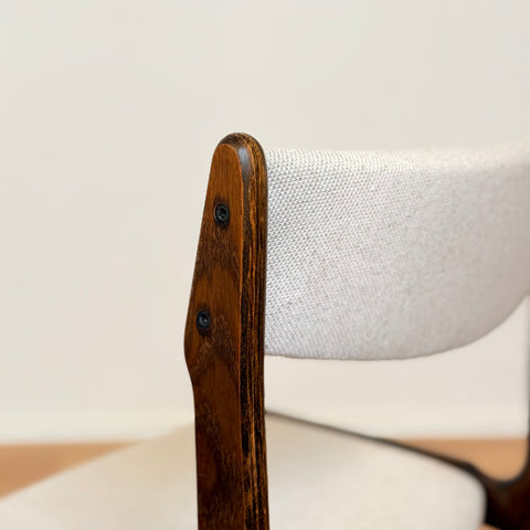 Danish dining chairs in solid stained oak by Erik Buch