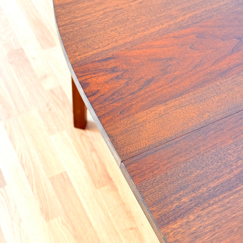 Swedish oval dining table in walnut by Bertil Fridhagen