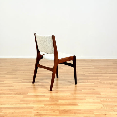 Danish dining chairs in solid walnut by Erik Buch