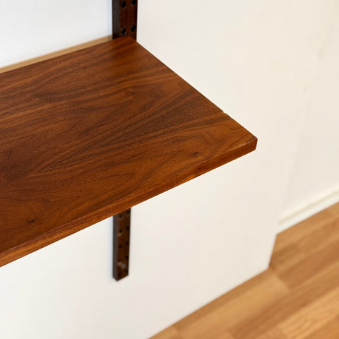 Danish wall unit / shelving system in walnut by Poul Cadovius
