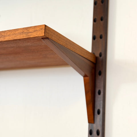 Danish wall unit / shelving system in walnut by Poul Cadovius
