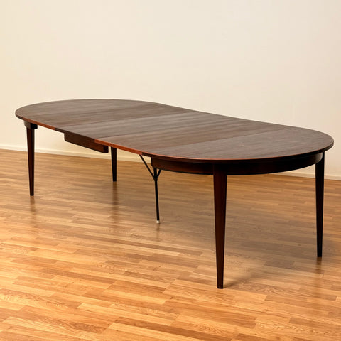 Danish round dining table in Santos rosewood by Oman Junn