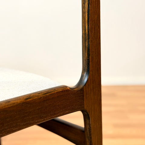 Danish dining chairs in solid stained oak by Erik Buch