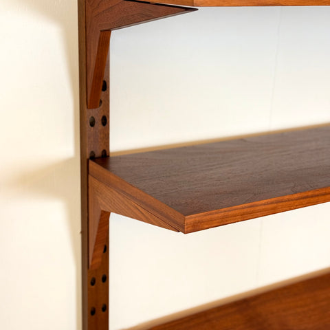 Danish wall unit / shelving system in walnut by Poul Cadovius