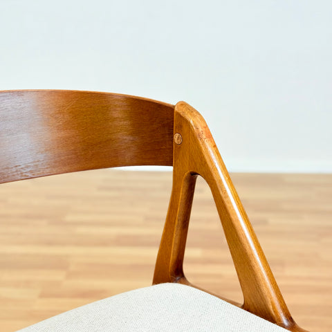 Danish single dining chair in teak by Henning Kjærnulf