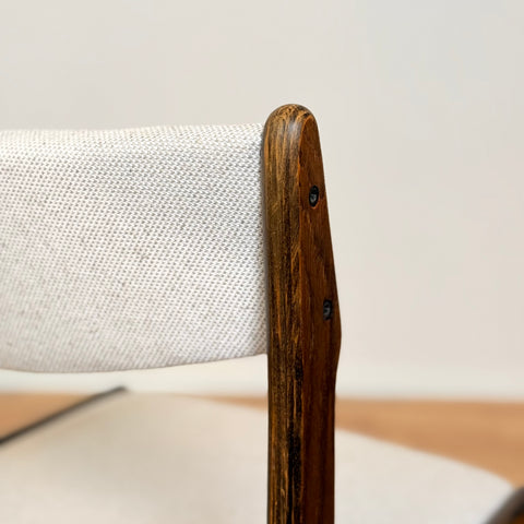 Danish dining chairs in solid stained oak by Erik Buch