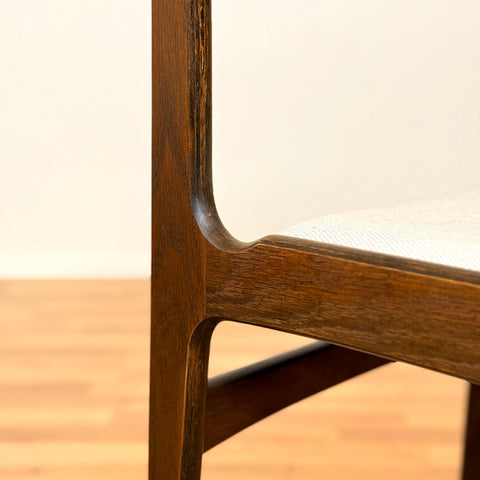 Danish dining chairs in solid stained oak by Erik Buch
