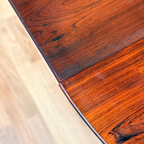 Danish round dining table in Santos rosewood