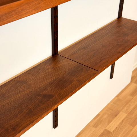 Danish wall unit / shelving system in walnut by Poul Cadovius