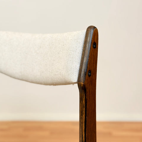 Danish dining chairs in solid stained oak by Erik Buch