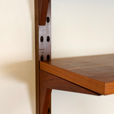 Danish wall unit / shelving system in walnut by Poul Cadovius