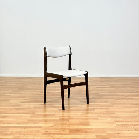 Danish dining chairs in solid stained oak by Erik Buch