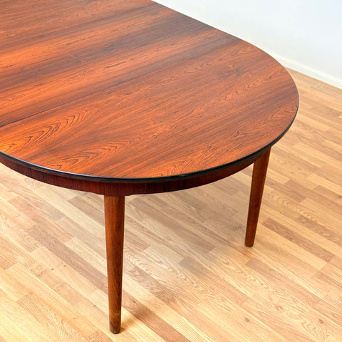 Danish round dining table in Santos rosewood