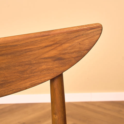 Single danish dining chairs in walnut by Harry Østergaard