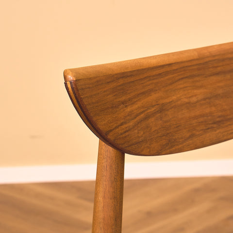 Single danish dining chairs in walnut by Harry Østergaard