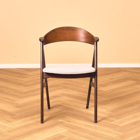 Danish dining chairs in stained teak by Kai Kristiansen