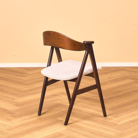Danish dining chairs in stained teak by Kai Kristiansen