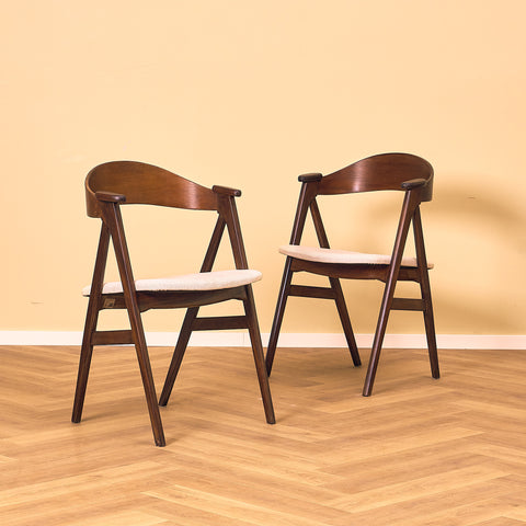 Danish dining chairs in stained teak by Kai Kristiansen