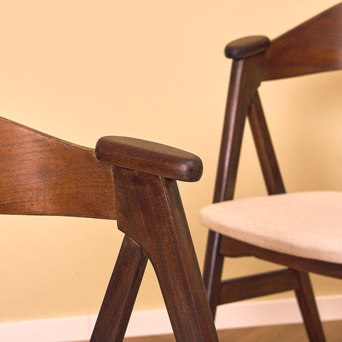 Danish dining chairs in stained teak by Kai Kristiansen