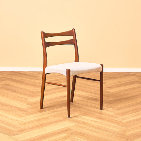 Danish dining chairs in teak in the style of Ejner Larsen