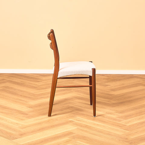 Danish dining chairs in teak in the style of Ejner Larsen