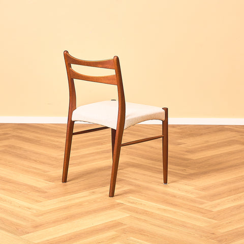 Danish dining chairs in teak in the style of Ejner Larsen