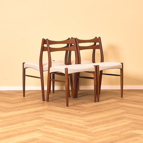 Danish dining chairs in teak in the style of Ejner Larsen