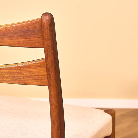 Danish dining chairs in teak in the style of Ejner Larsen