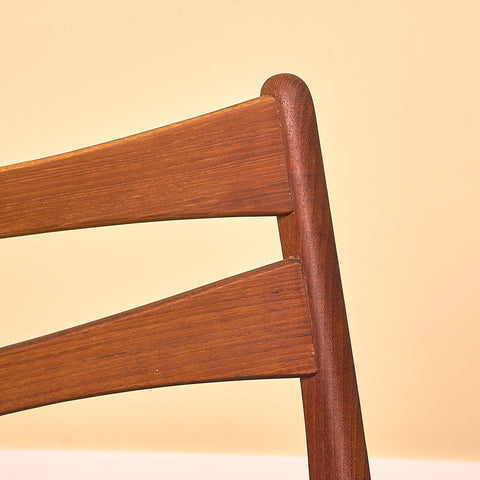 Danish dining chairs in teak in the style of Ejner Larsen