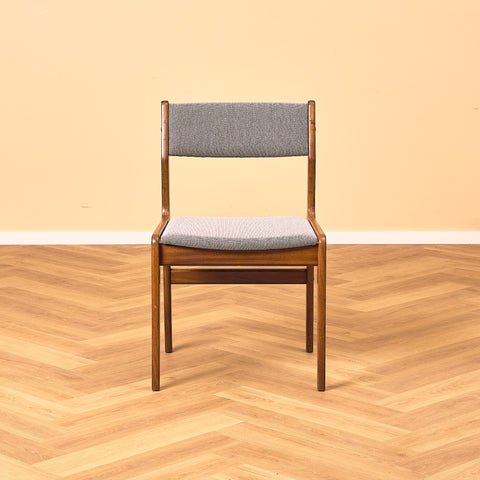 Danish dining chairs in walnut by Farstrup