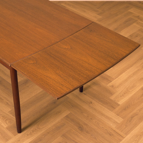 Danish rectangular dining table in teak and walnut