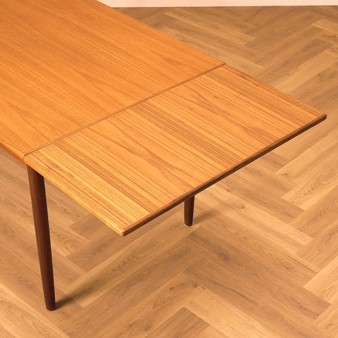 Danish dining table in teak and walnut