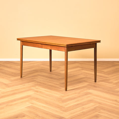 Danish dining table in teak and walnut