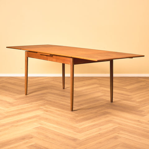 Danish dining table in teak and walnut