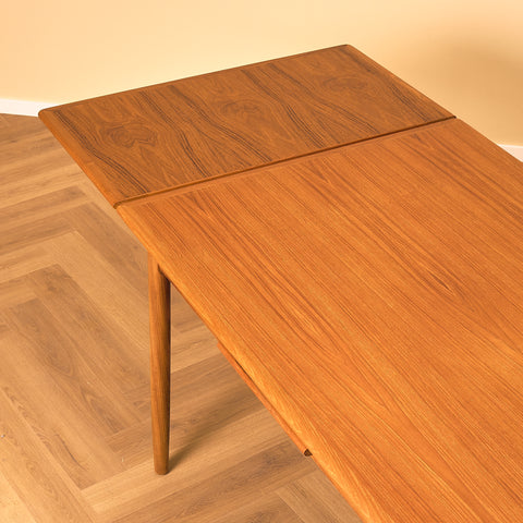 Danish dining table in teak and walnut