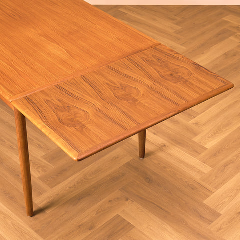 Danish dining table in teak and walnut