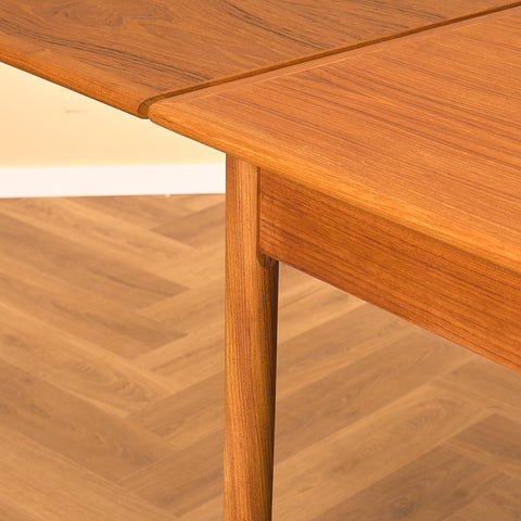 Danish dining table in teak and walnut