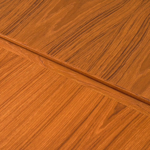 Danish dining table in teak and walnut