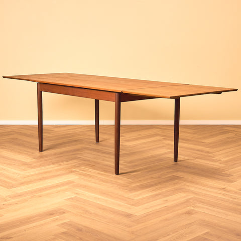 Danish dining table in teak and walnut