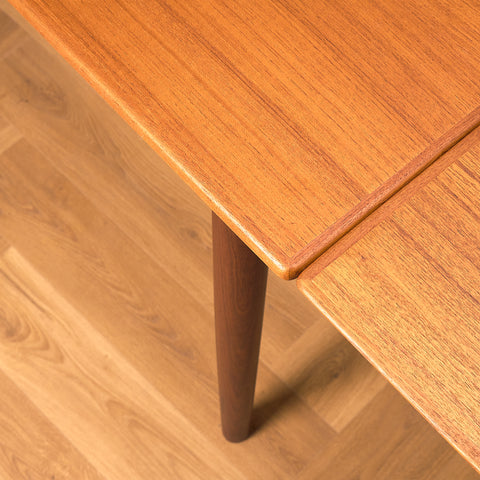 Danish dining table in teak and walnut
