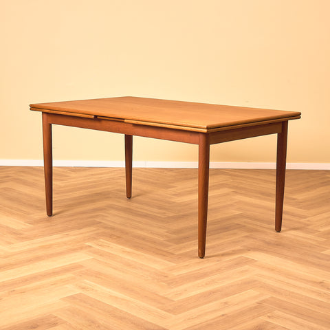 Danish dining table in teak and walnut