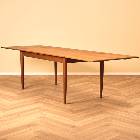 Danish dining table in teak and walnut