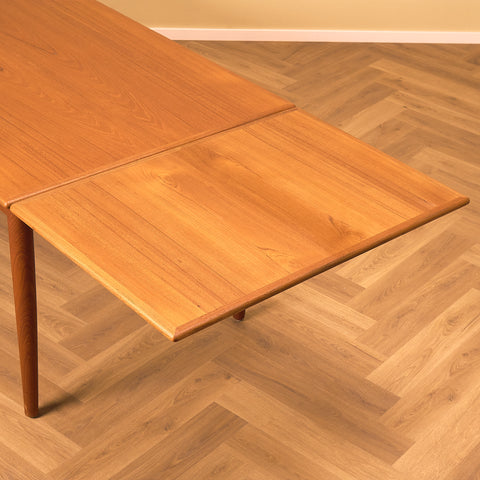 Danish dining table in teak and walnut