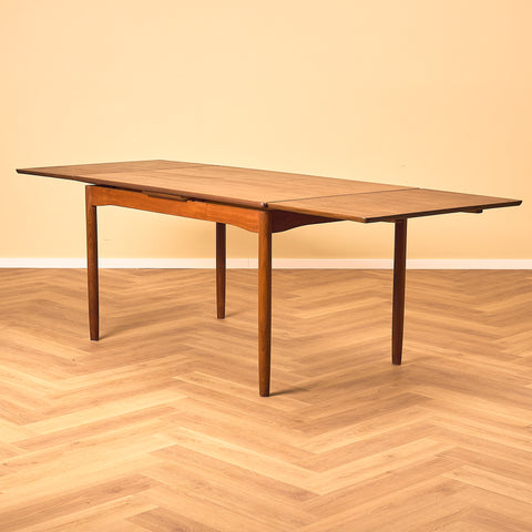 Danish dining table in teak and walnut