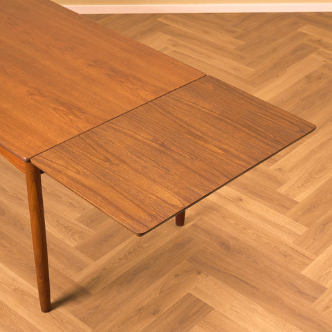 Danish dining table in teak and walnut